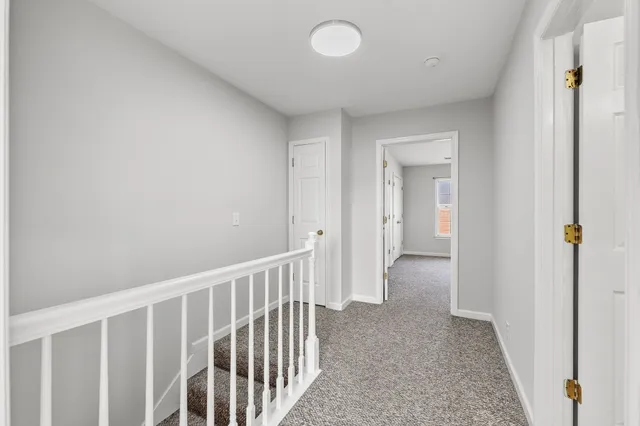 a bed room with a bed and a window