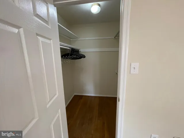 a view of a room that has a large window