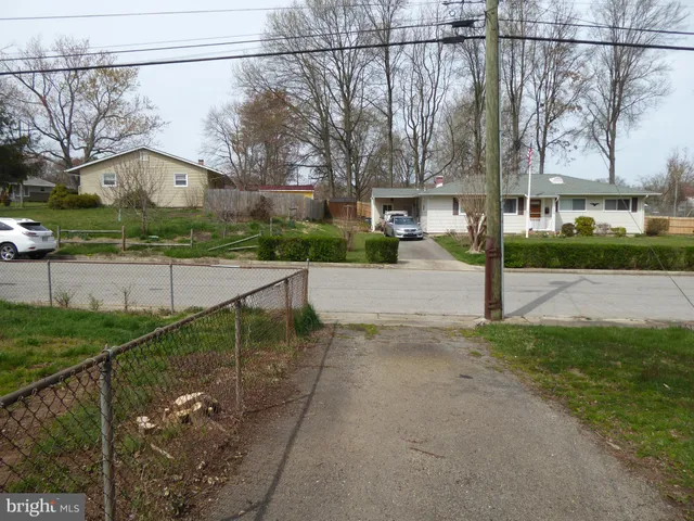 a view of a street with a building in the background