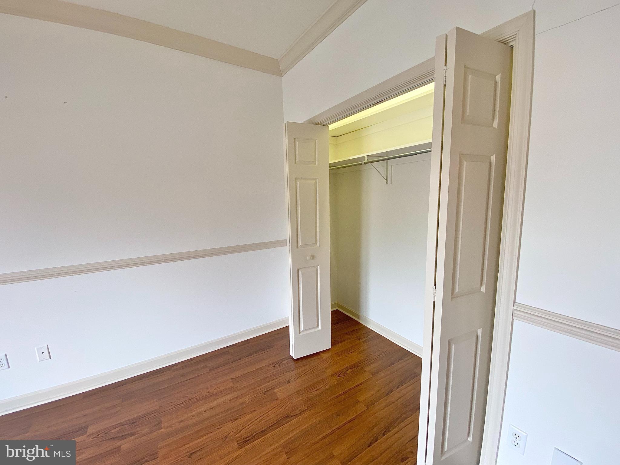 1476 Spring Side Drive East Chambersburg, PA 17202 - Photo 19 of 27 a view of an empty room with wooden floor