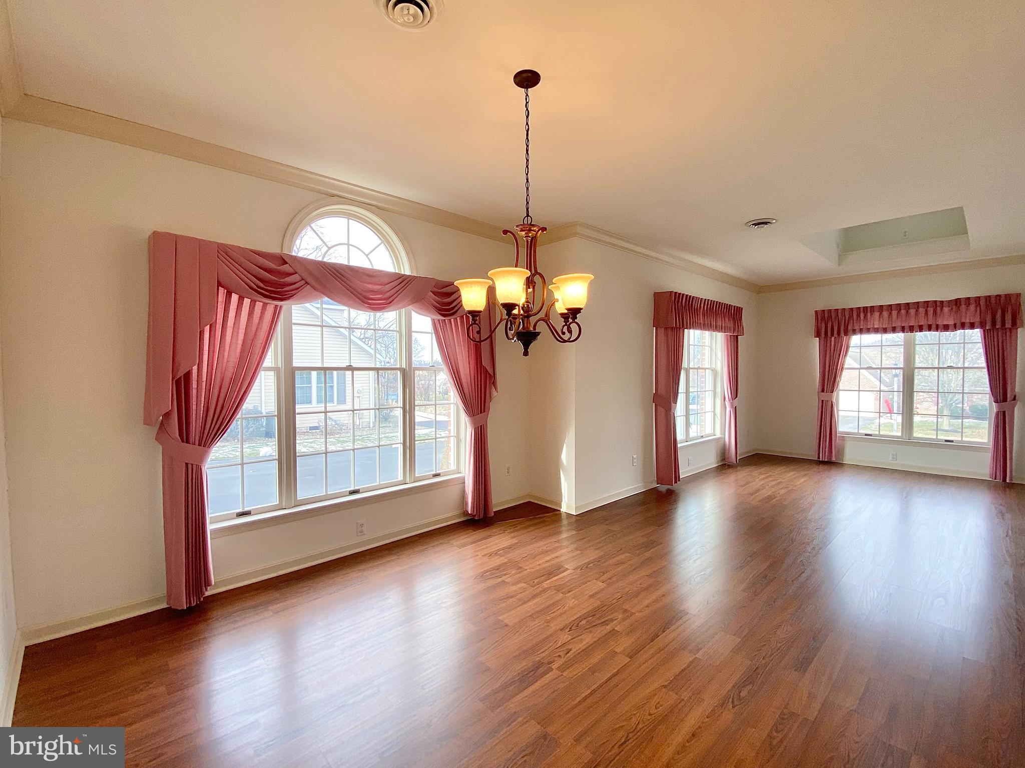 1476 Spring Side Drive East Chambersburg, PA 17202 - Photo 6 of 27 a view of a livingroom with wooden floor and a window