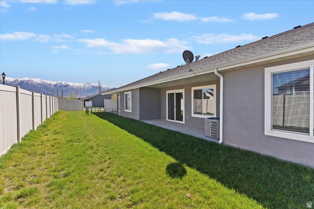 2028 West Grace Way Layton, UT 84041 - Photo 28 of 36 Fenced backyard featuring a patio and a mountain view