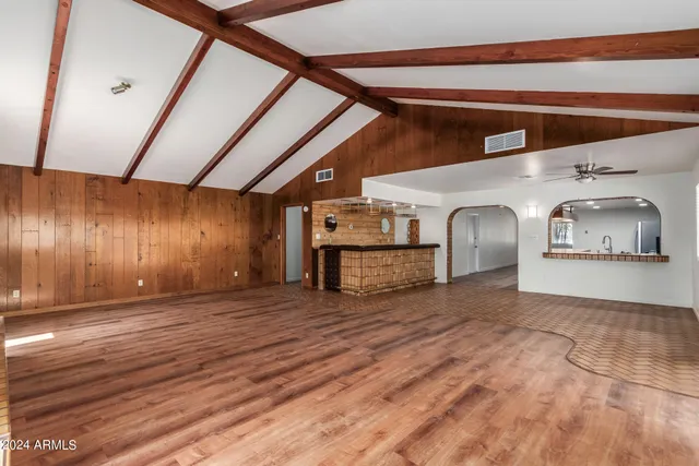 a view of a livingroom with wooden floor