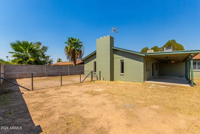 a house with trees in the background