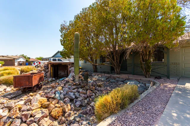 a view of a backyard with sitting area
