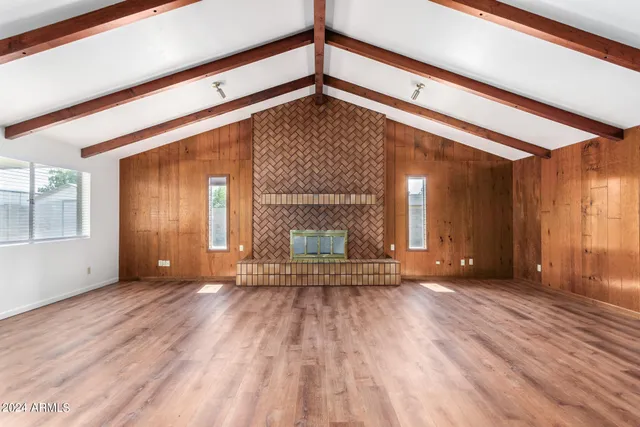 a view of a kitchen with wooden floor