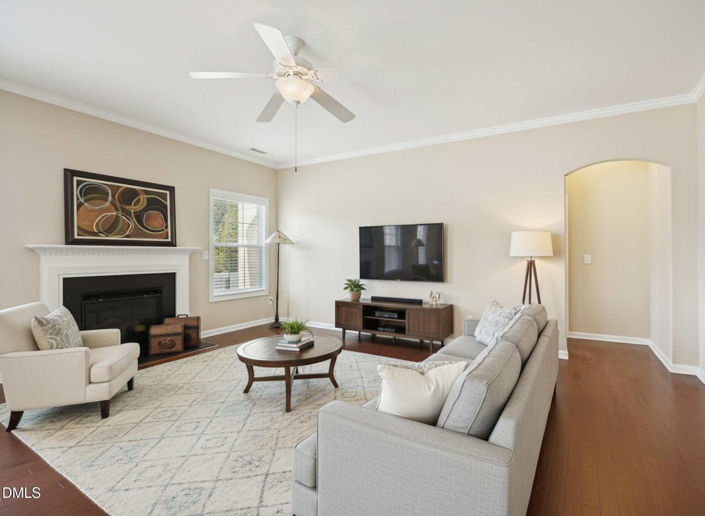 11 Hidden Ridge Court Durham, NC 27707 - Photo 5 of 30 a living room with furniture a fireplace and a flat screen tv
