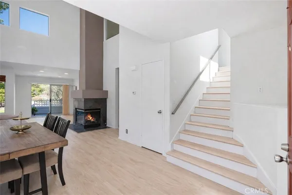 a view of a livingroom with furniture and a fireplace