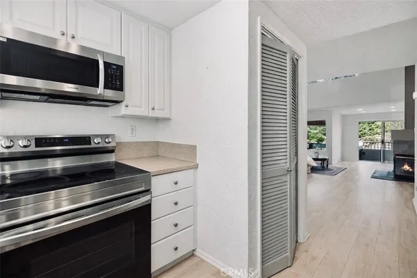 a kitchen with a stove and a microwave