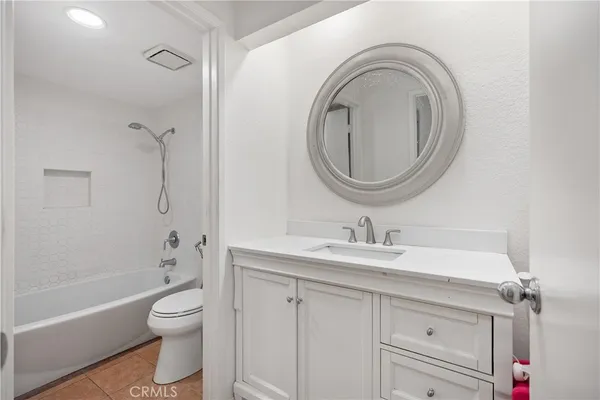 a bathroom with a sink a toilet and a bathtub