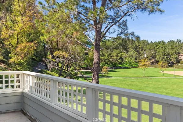a view of outdoor space with deck and a yard