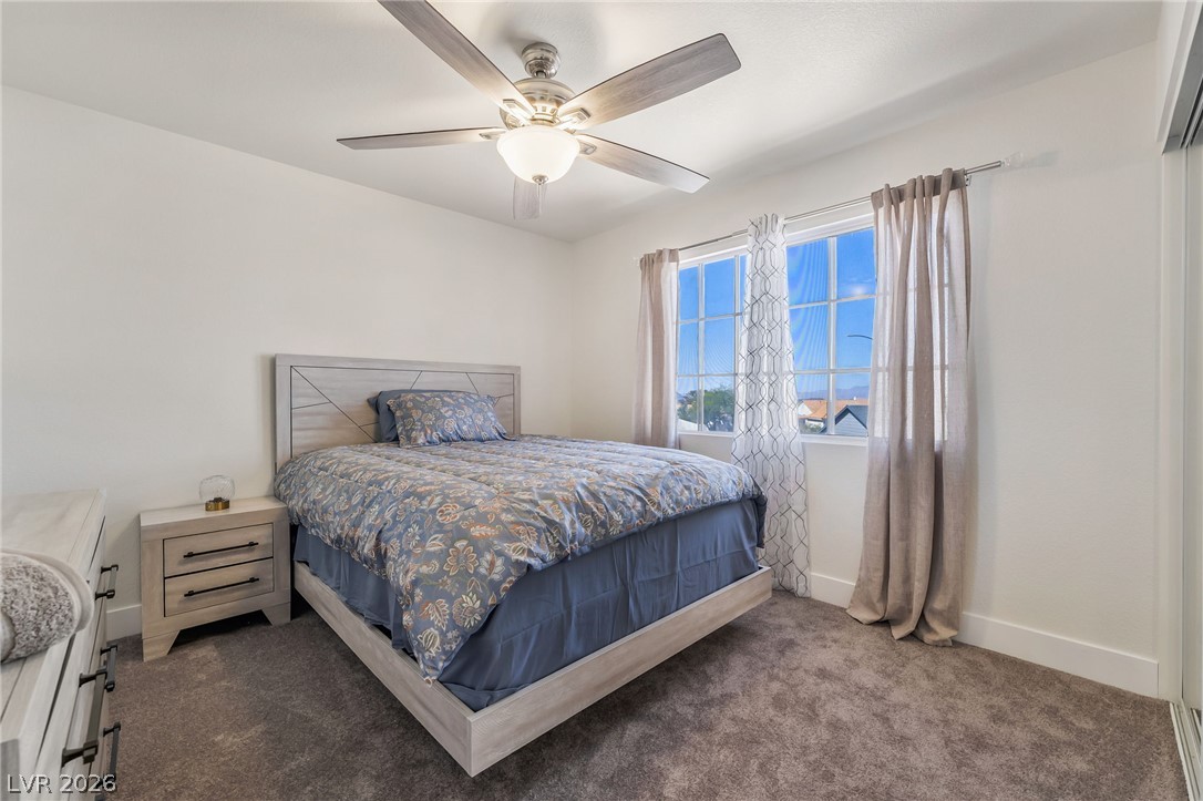 104 Appian Way Henderson, NV 89002 - Photo 21 of 24 A tranquil bedroom with a spacious window, perfect for quiet retreats.