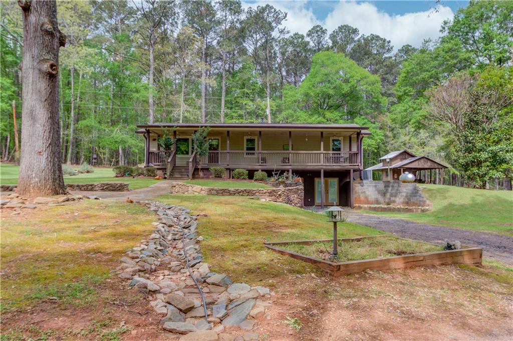 207 Boogers Hill Road Oxford, GA 30054 - Photo 1 of 39 front view of a house with a yard