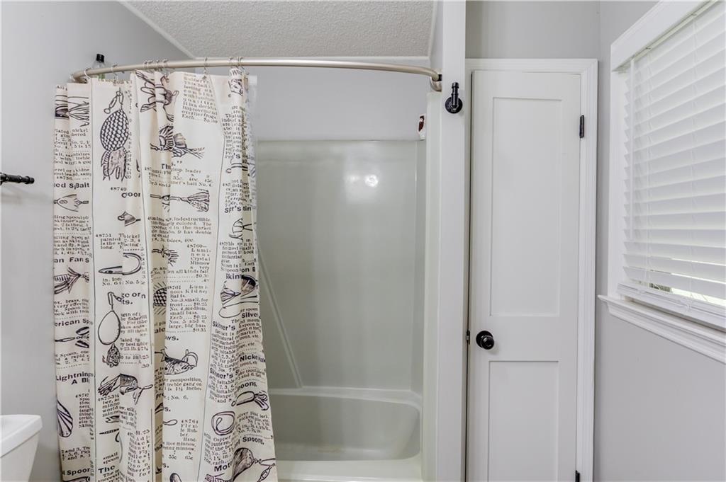 207 Boogers Hill Road Oxford, GA 30054 - Photo 20 of 39 a bathroom with a shower and a door
