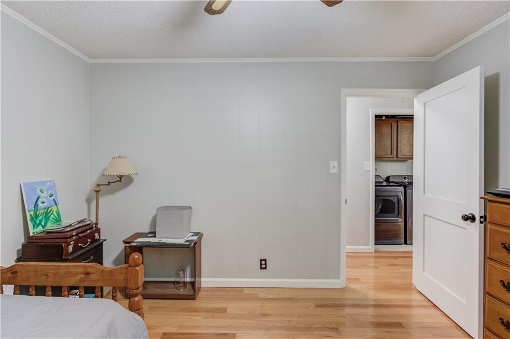 207 Boogers Hill Road Oxford, GA 30054 - Photo 23 of 39 a living room with furniture and a wooden floor