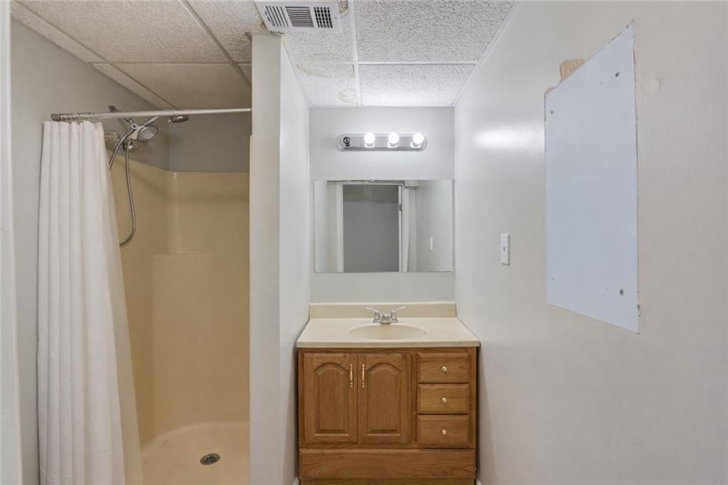 207 Boogers Hill Road Oxford, GA 30054 - Photo 25 of 39 a bathroom with a sink and a mirror