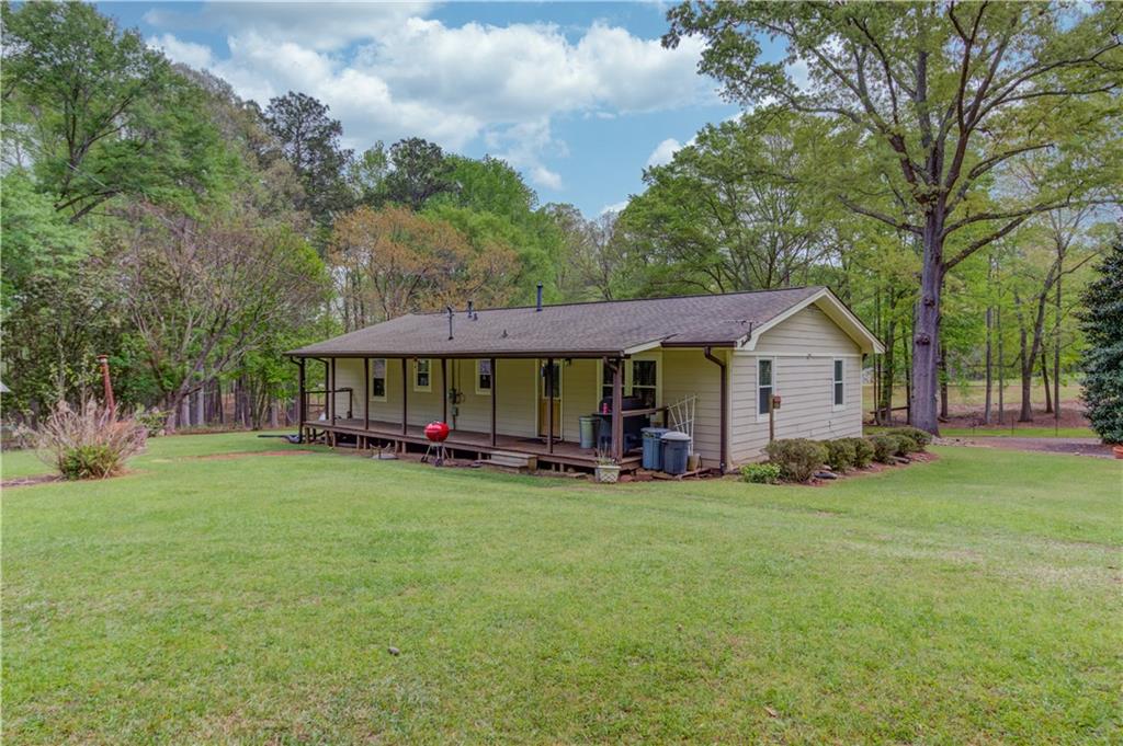 207 Boogers Hill Road Oxford, GA 30054 - Photo 30 of 39 a view of a house with garden and trees