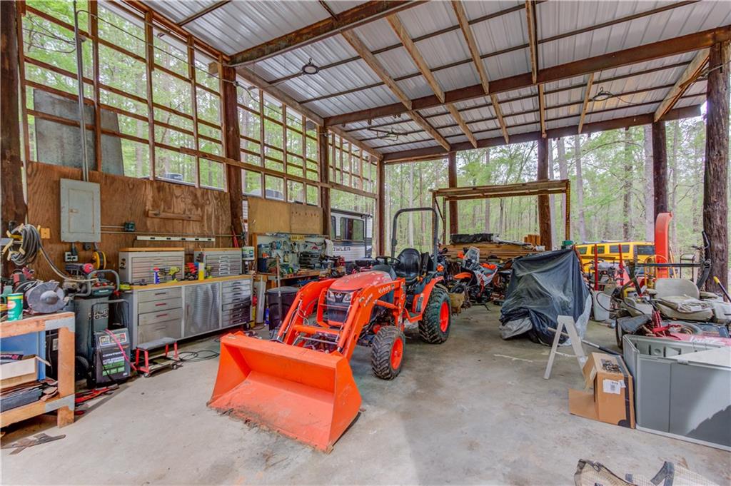 207 Boogers Hill Road Oxford, GA 30054 - Photo 32 of 39 a view of gym equipment with a garage