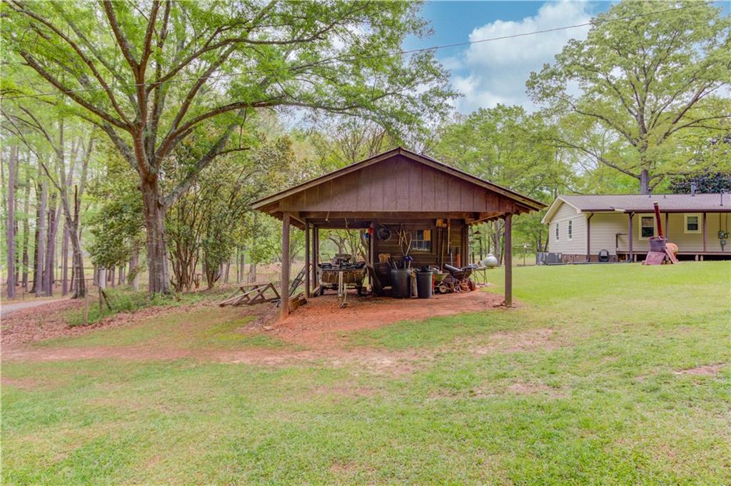 207 Boogers Hill Road Oxford, GA 30054 - Photo 36 of 39 a view of a house with a yard and sitting area