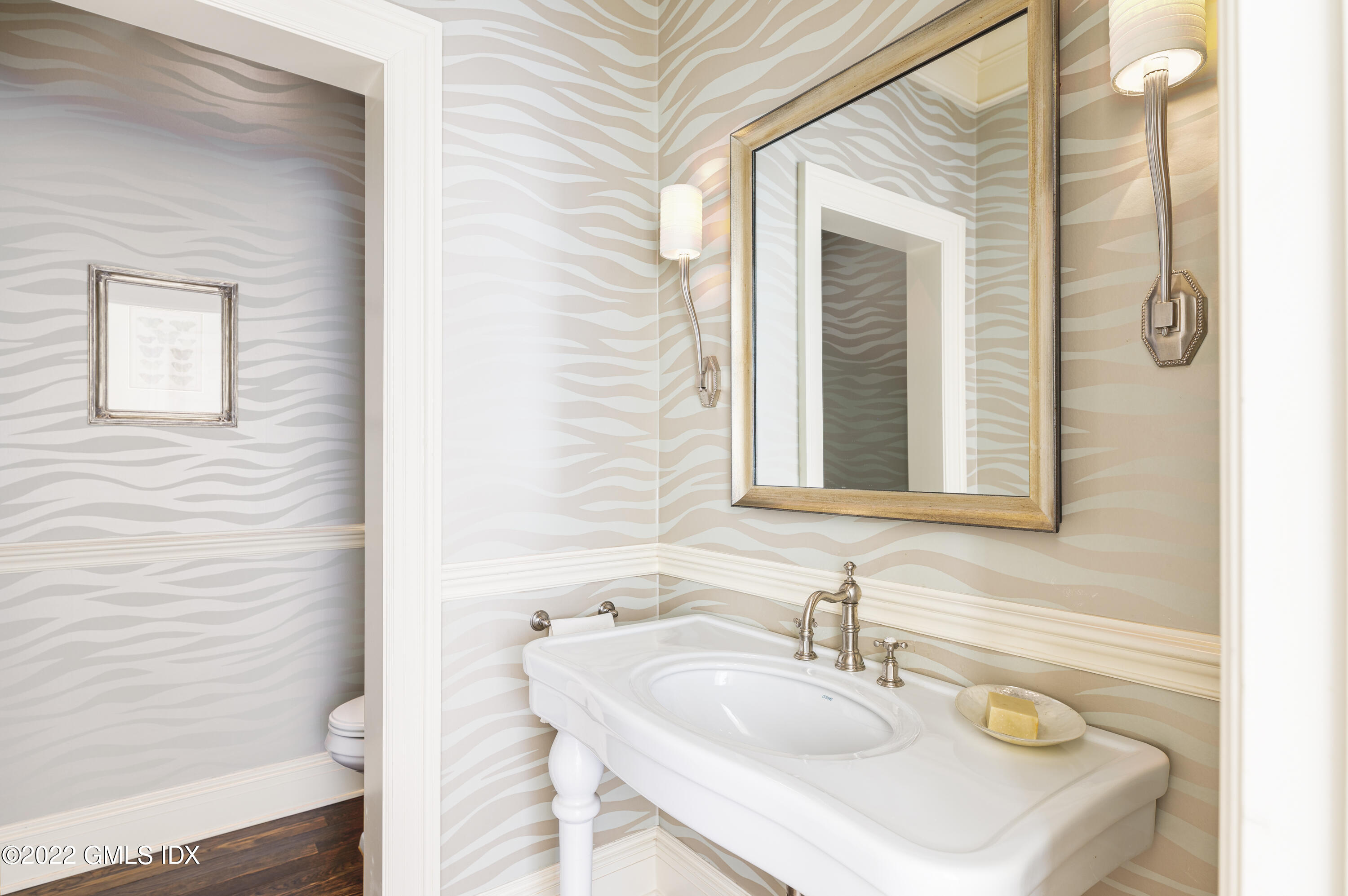 149 Parsonage Road Greenwich, CT 06830 - Photo 25 of 35 a bathroom with a sink and a mirror