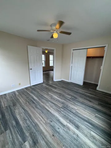 a view of a livingroom with wooden floor