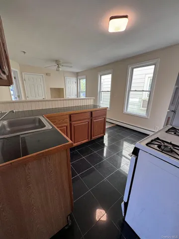 a room with lots of appliances and windows