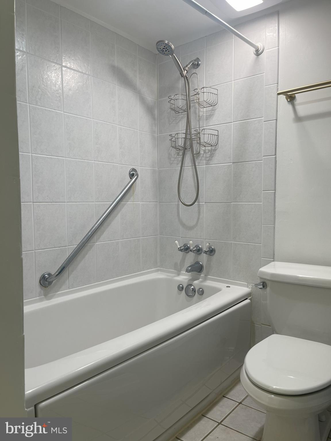1661 Parkcrest Circle, Unit 100 Reston, VA 20190 - Photo 12 of 13 a bathroom with a toilet and a shower