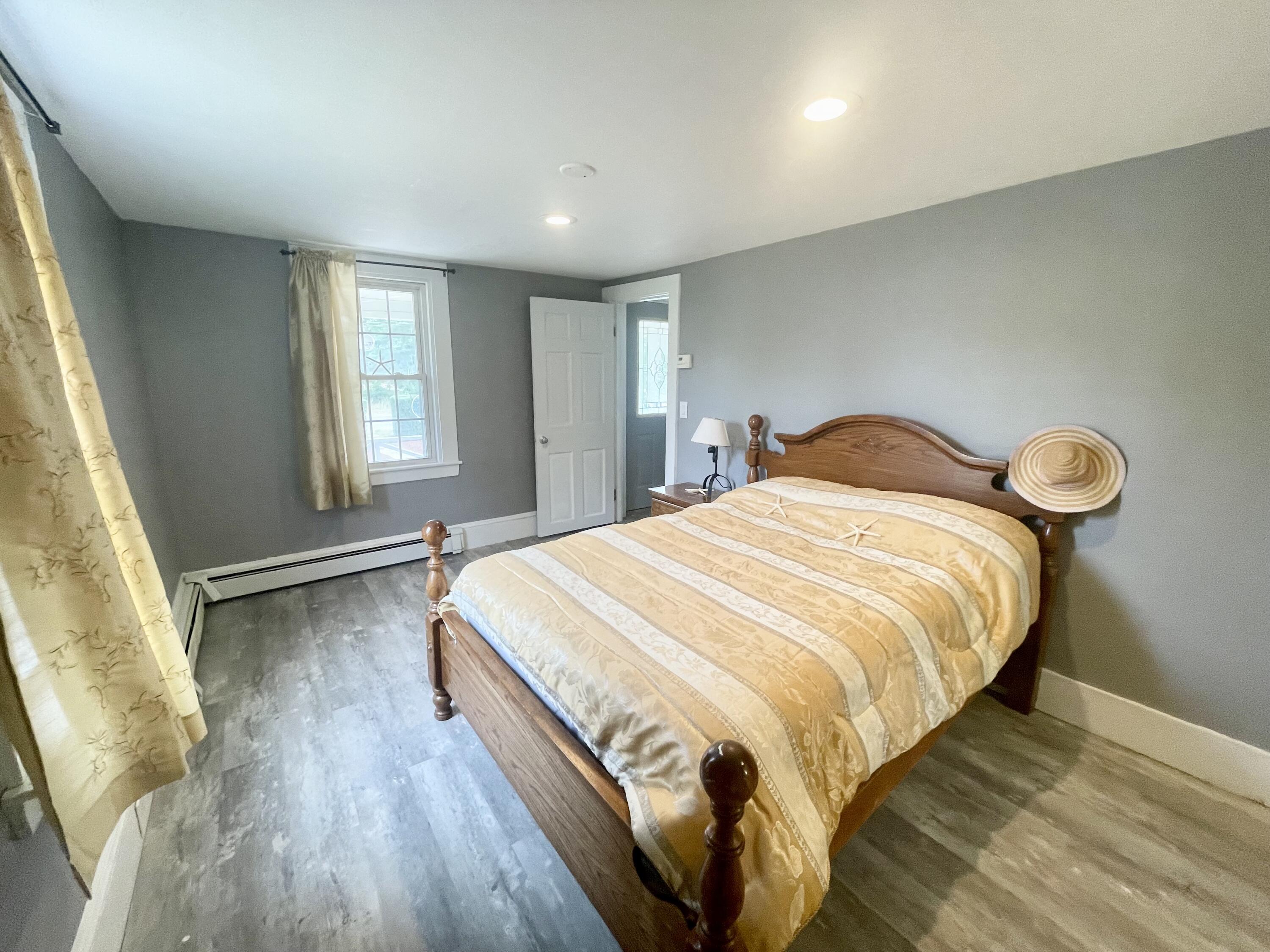 740 Sandwich Road Bourne, MA 02532 - Photo 25 of 50 a bedroom with a bed and a window