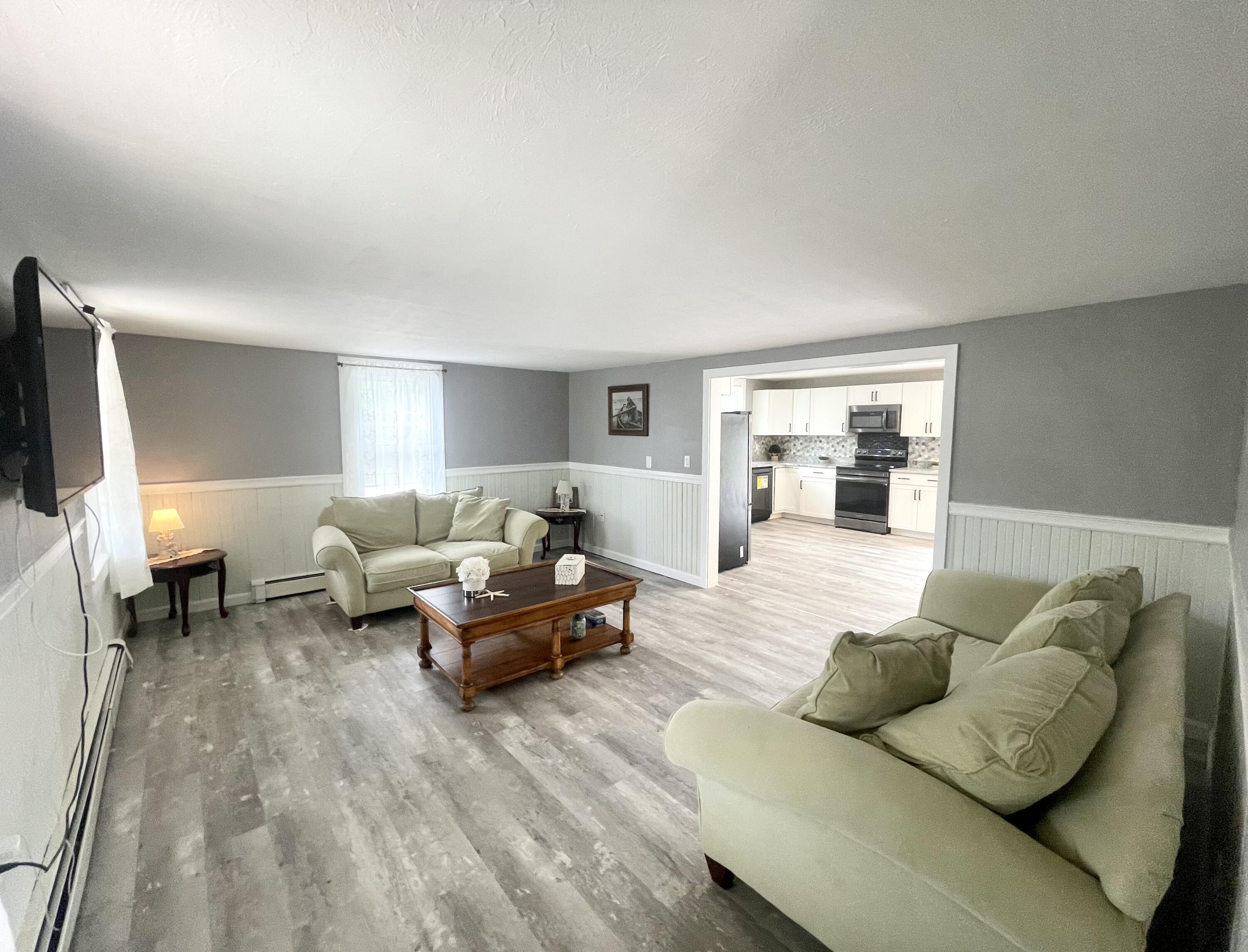 740 Sandwich Road Bourne, MA 02532 - Photo 7 of 50 a living room with furniture and a flat screen tv