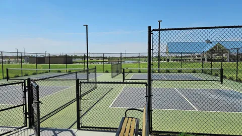 a view of a deck with a floor to ceiling window