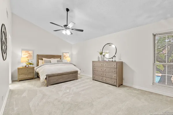 a bedroom with bed and a window