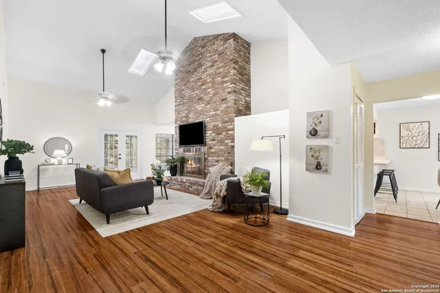 a living room with furniture and a fireplace
