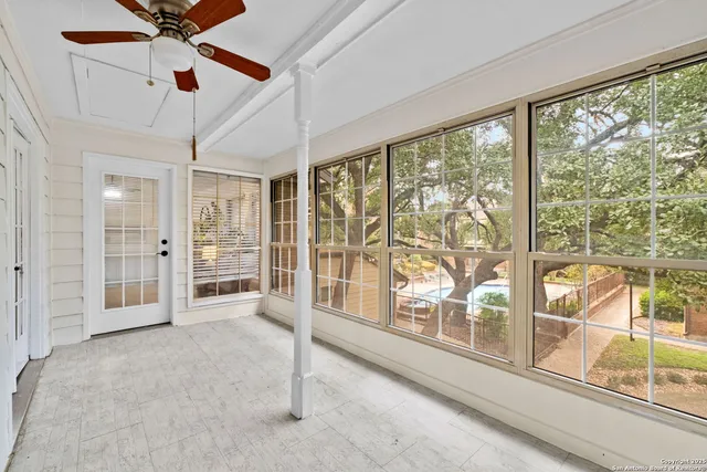 a view of a swimming pool with outdoor seating