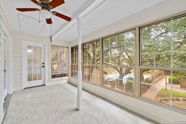 a view of a swimming pool with outdoor seating