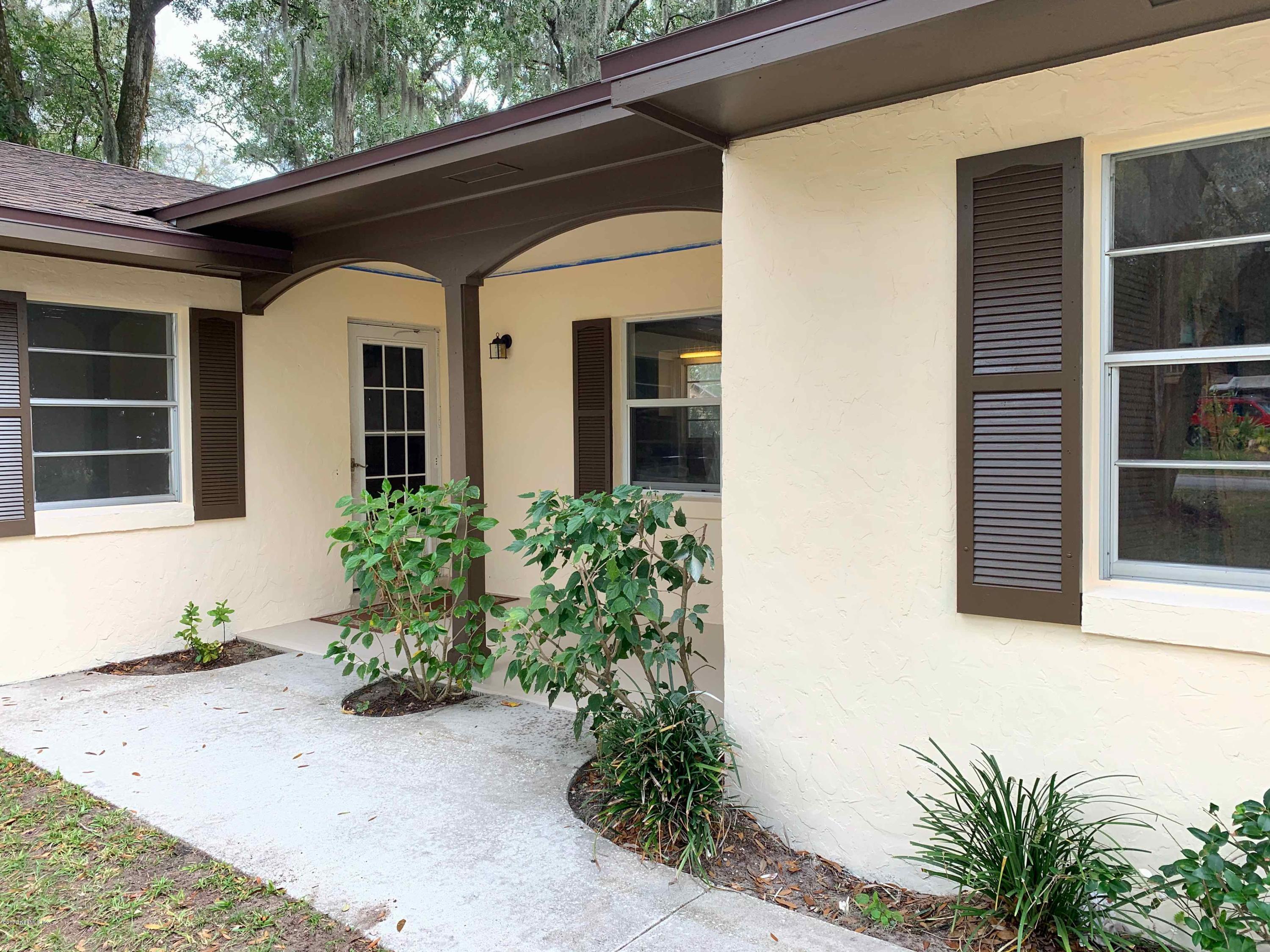 111 Cypress Road St. Augustine, FL 32086 - Photo 3 of 10 a front view of a house with a yard