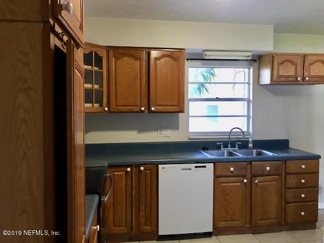 111 Cypress Road St. Augustine, FL 32086 - Photo 4 of 10 a kitchen with a sink cabinets and window
