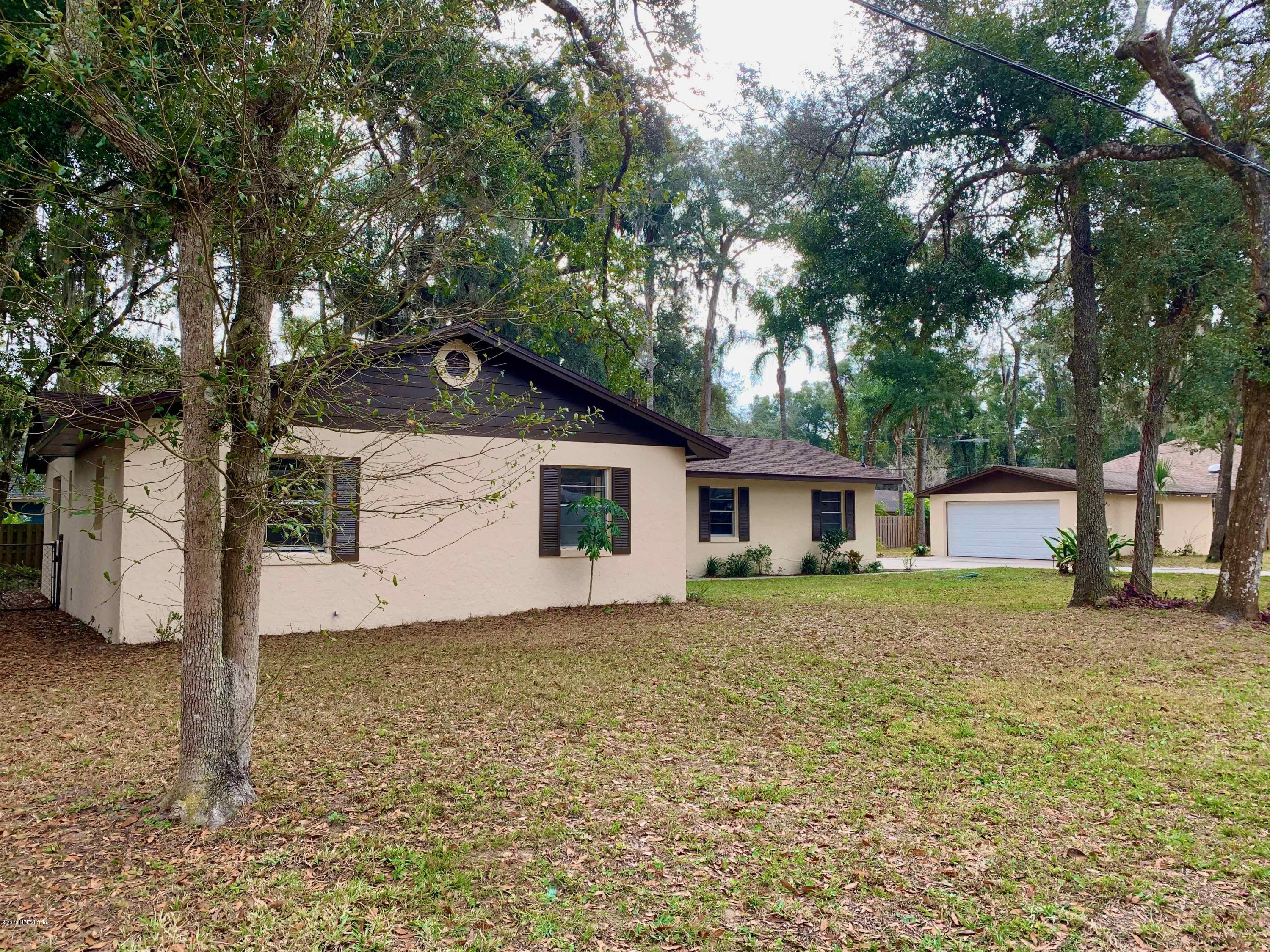 111 Cypress Road St. Augustine, FL 32086 - Photo 8 of 10 a house with trees in front of it