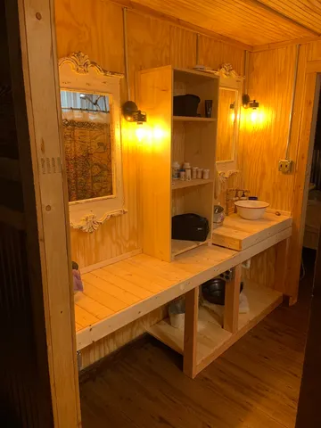 a bathroom with a toilet and a shower