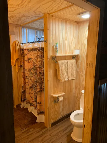 a bathroom with a shower and a tub