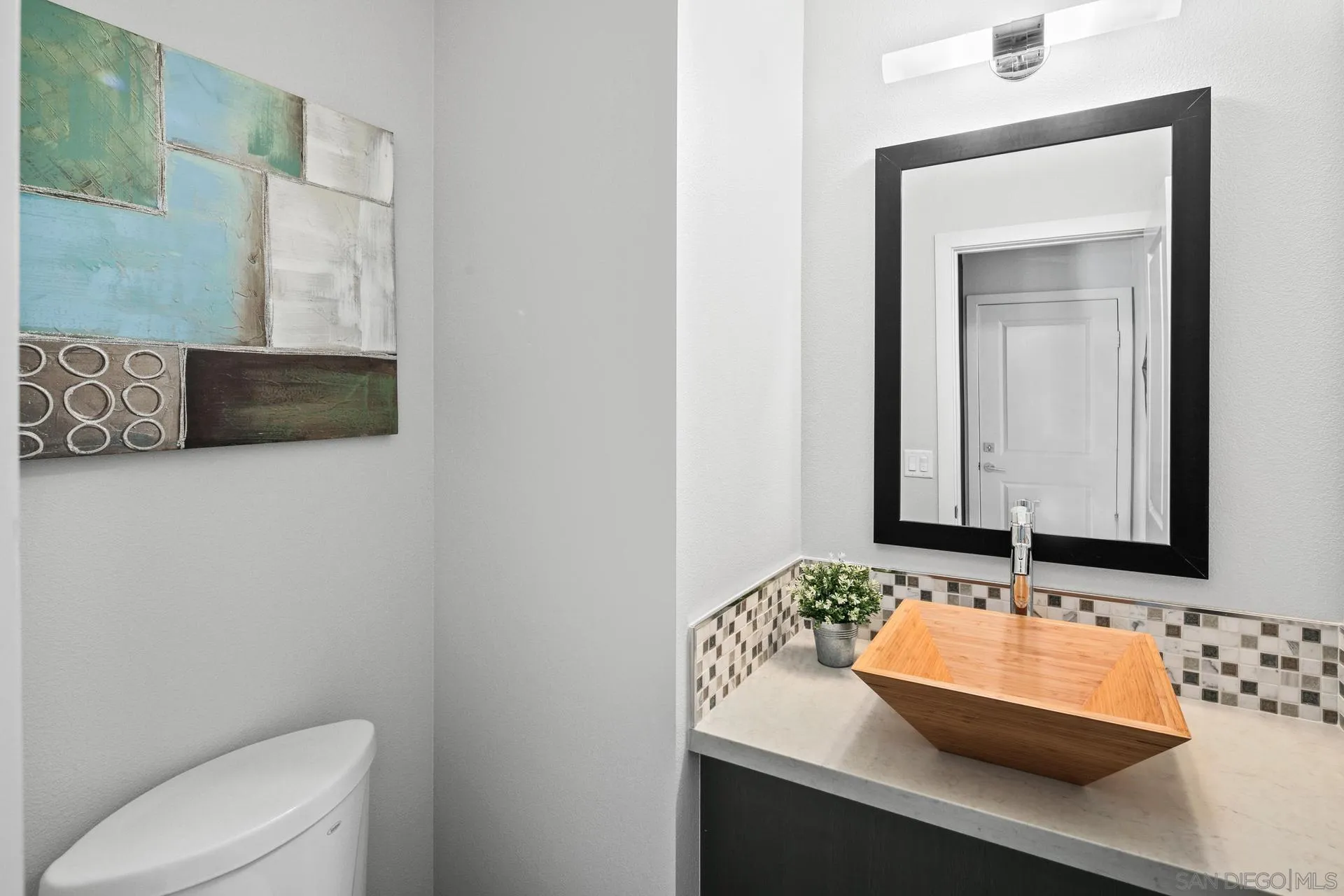 1676 Shorebreak Way Encinitas, CA 92024 - Photo 12 of 62 a bathroom with a sink and a mirror