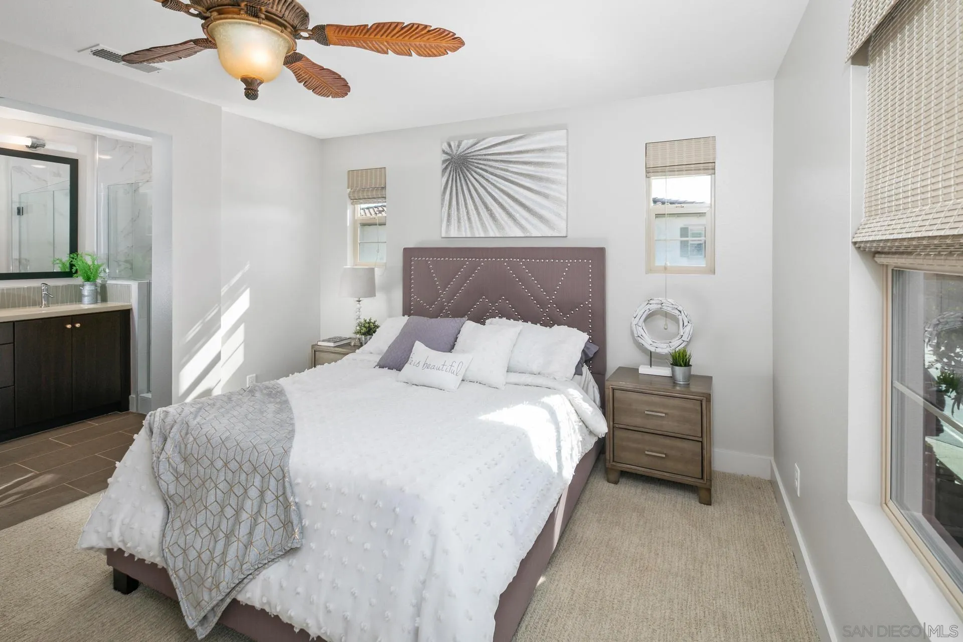 1676 Shorebreak Way Encinitas, CA 92024 - Photo 15 of 62 a bedroom with a bed and a chandelier