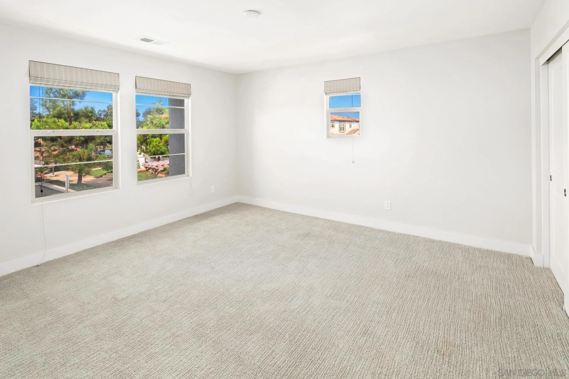 1676 Shorebreak Way Encinitas, CA 92024 - Photo 23 of 62 an empty room with windows