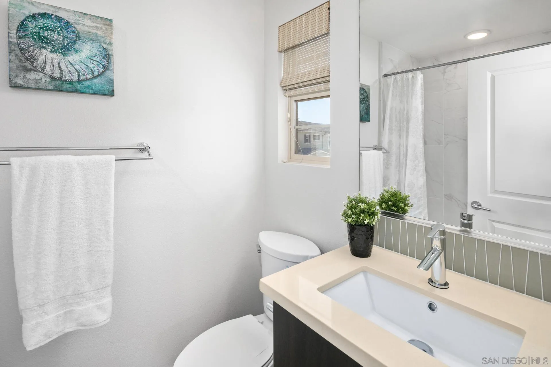 1676 Shorebreak Way Encinitas, CA 92024 - Photo 27 of 62 a bathroom with a sink toilet and shower