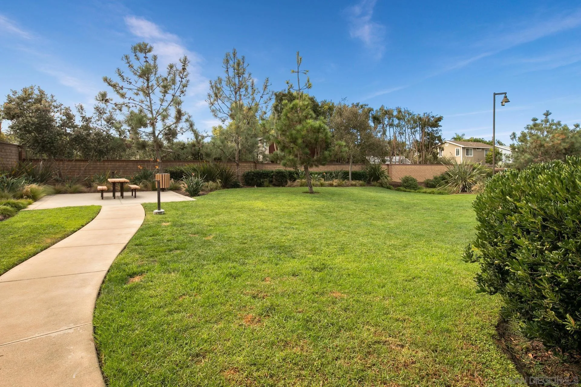 1676 Shorebreak Way Encinitas, CA 92024 - Photo 45 of 62 a view of a swimming pool with a yard