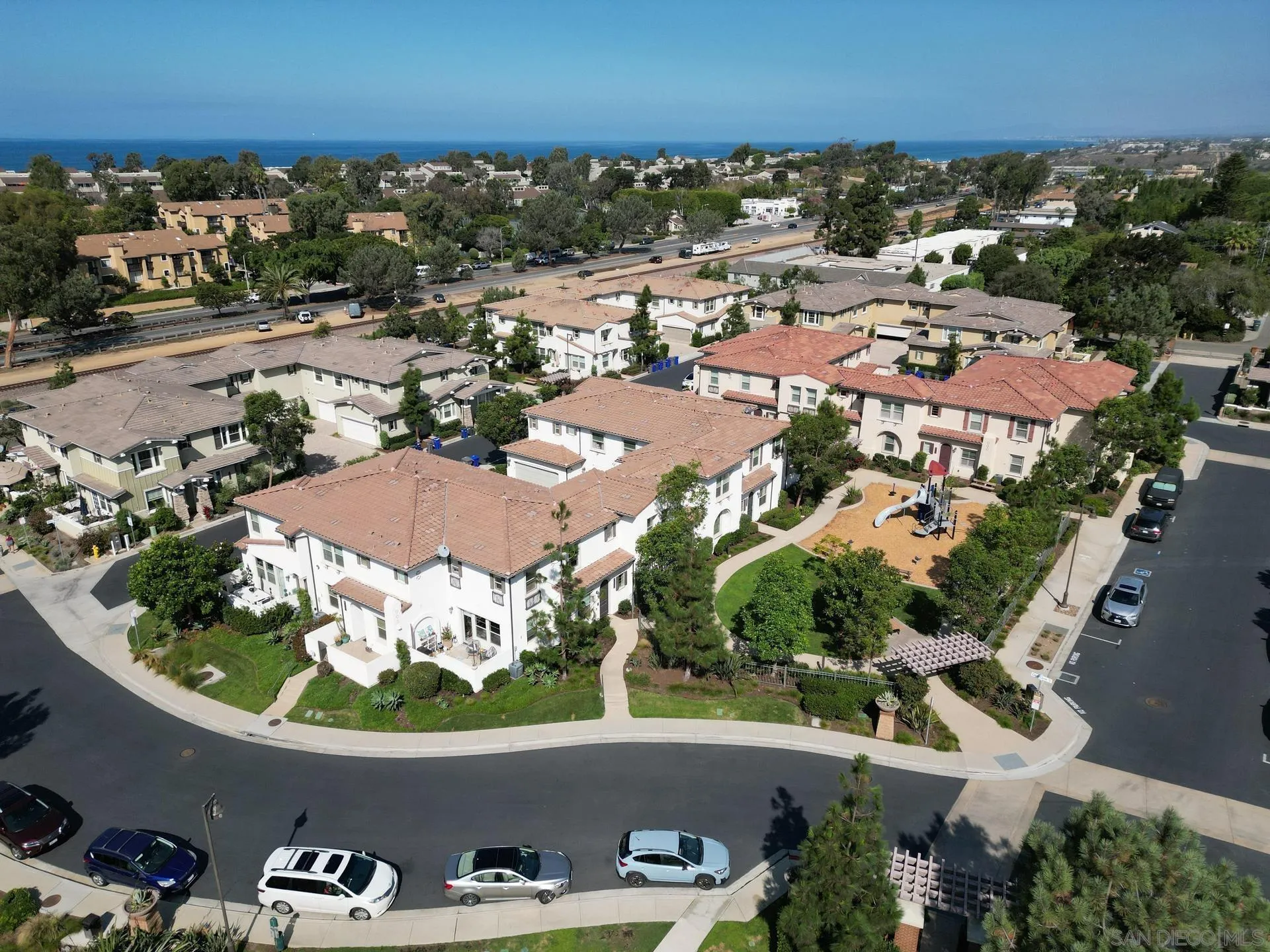 1676 Shorebreak Way Encinitas, CA 92024 - Photo 49 of 62 an aerial view of a house with a swimming pool outdoor seating and yard