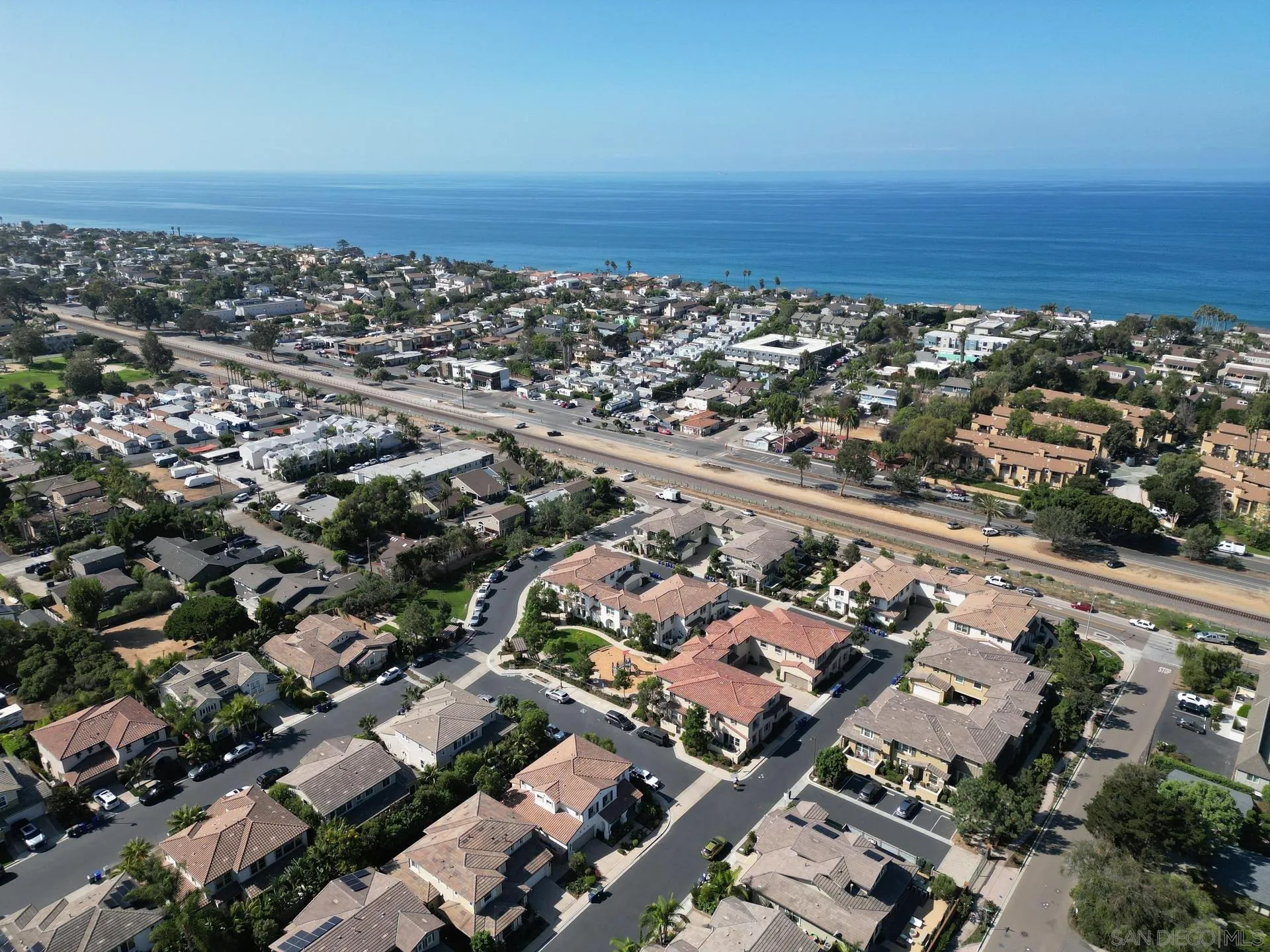 1676 Shorebreak Way Encinitas, CA 92024 - Photo 55 of 62 an aerial view of a city with lots of residential buildings and ocean view in back