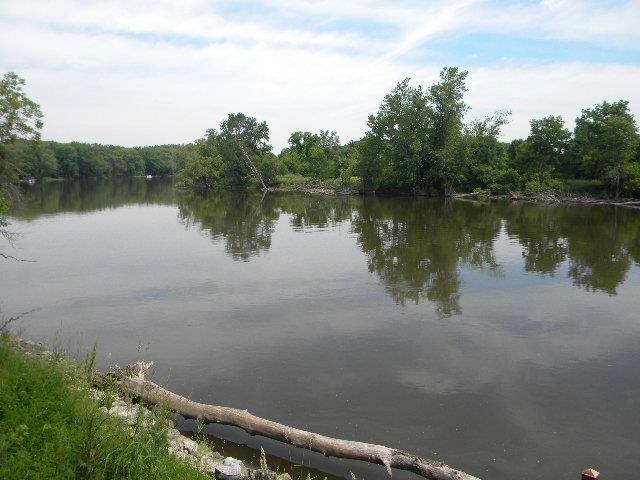 10727 Chicory Ridge Way Roscoe, IL 61073 - Photo 20 of 23 a view of a lake with houses in background