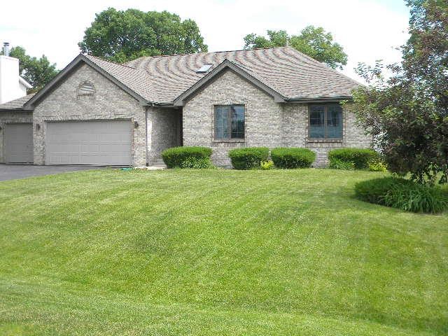 10727 Chicory Ridge Way Roscoe, IL 61073 - Photo 23 of 23 a view of a yard in front of a house with plants and large tree
