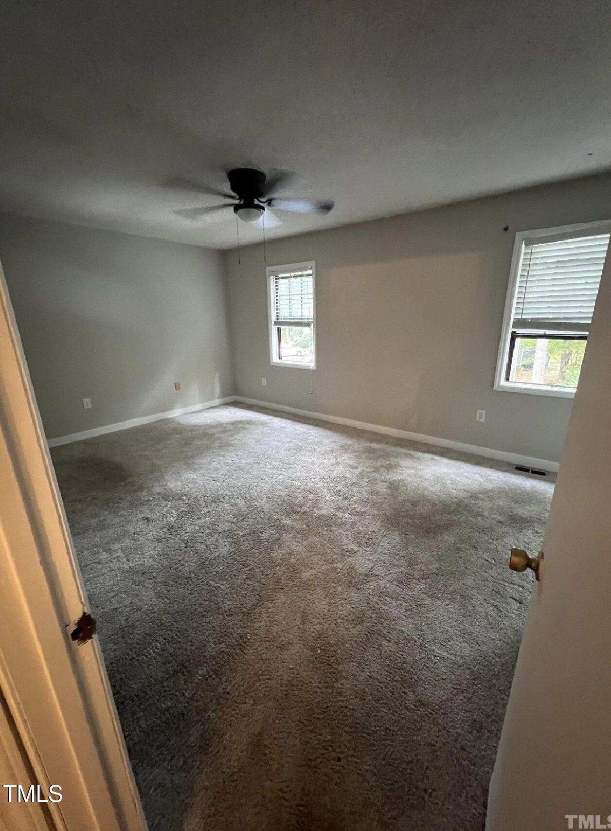 10 Willow Bridge Drive Durham, NC 27707 - Photo 13 of 16 en empty room with windows and entrance