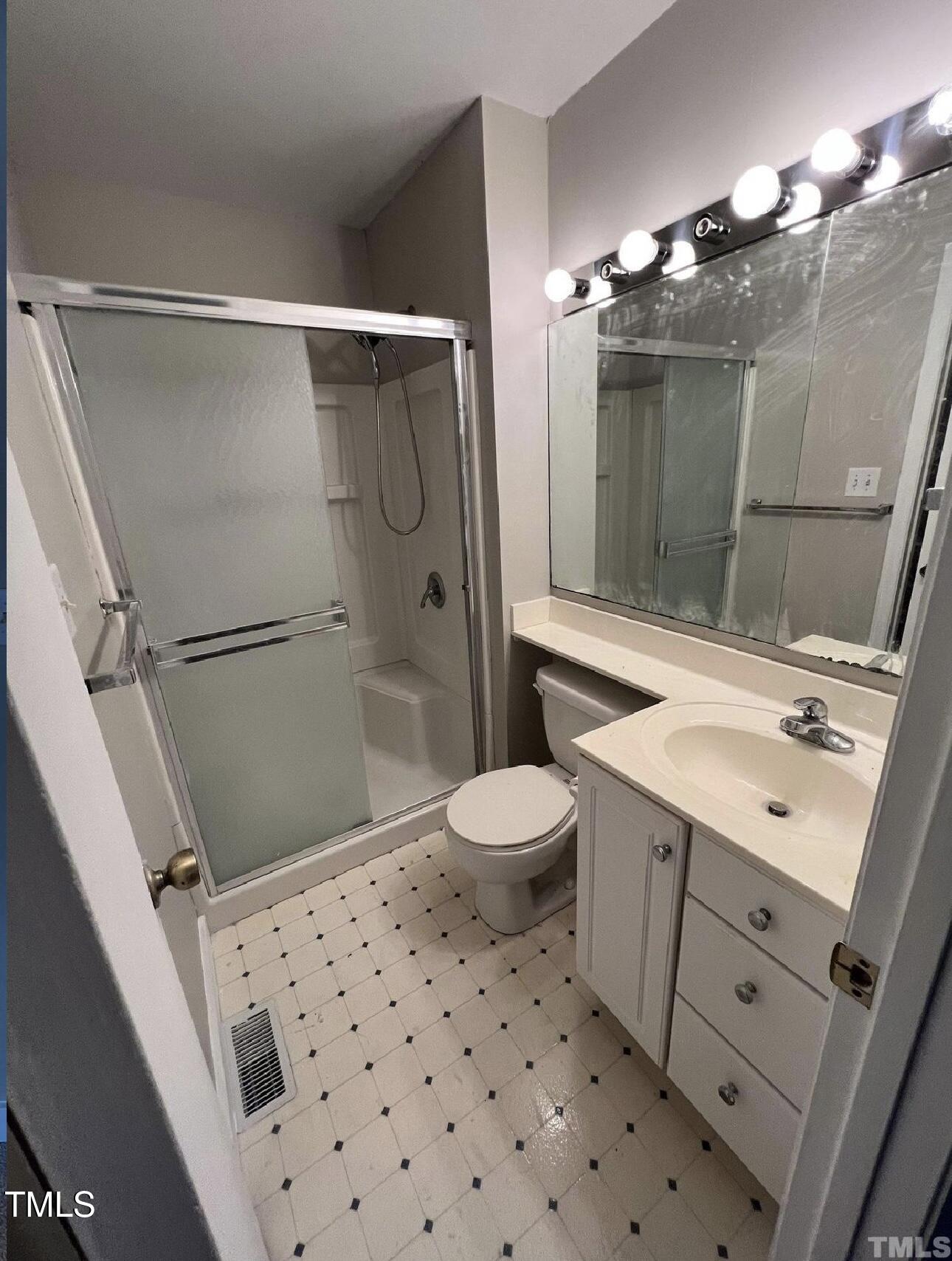 10 Willow Bridge Drive Durham, NC 27707 - Photo 14 of 16 a bathroom with a sink toilet and shower